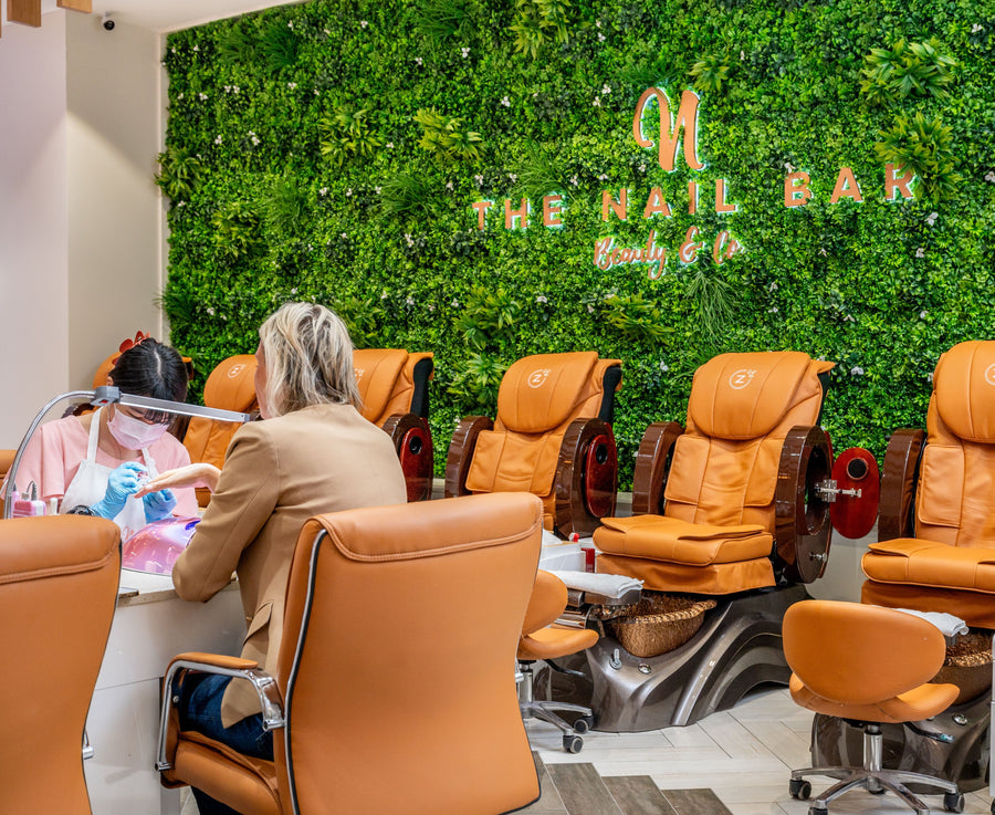 The Nail Bar client receiving a nail service